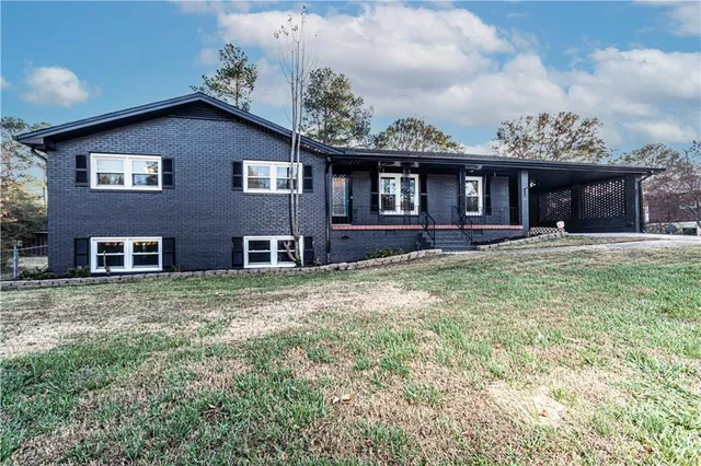a front view of a house with garden