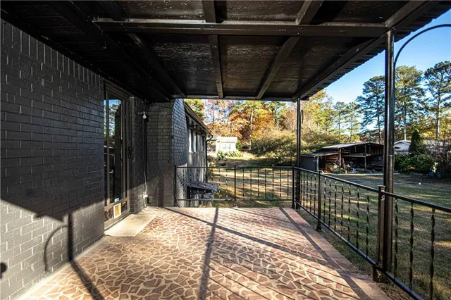 a view of a porch with wooden floor