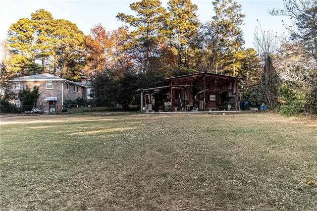a front view of a building with trees