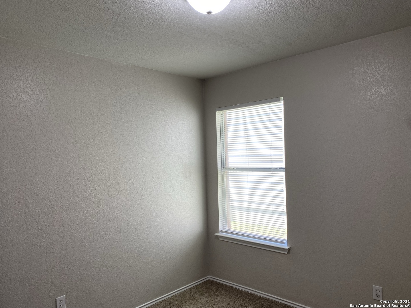 511 Mathis Meadow San Antonio, TX 78251 - Photo 8 of 13 an empty room with a window