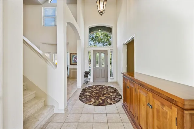 a view of a hallway and wooden floor windows