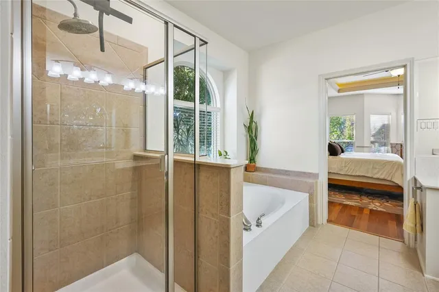 a bathroom with a tub and shower