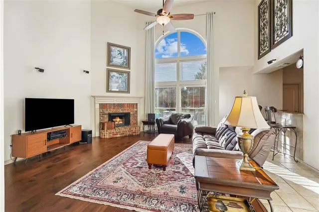 a living room with furniture fireplace and a flat screen tv