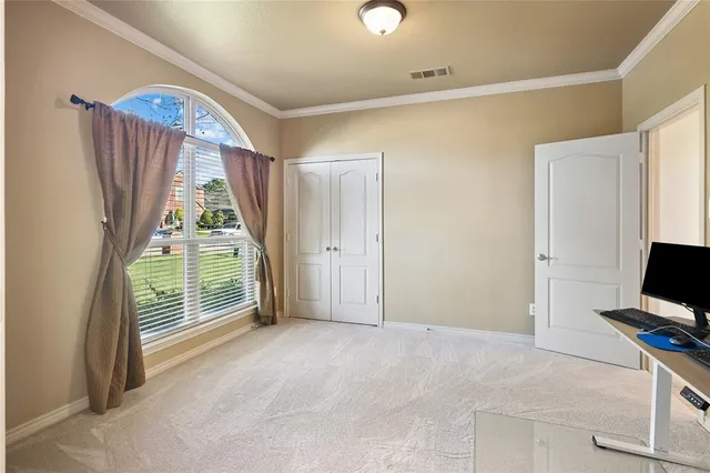 a view of room with a flat screen tv and a large window