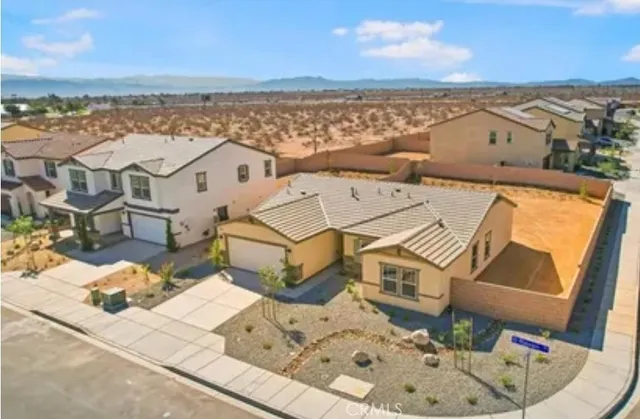 an aerial view of a house with a ocean view