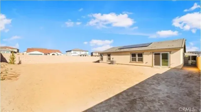 a balcony with table and chairs
