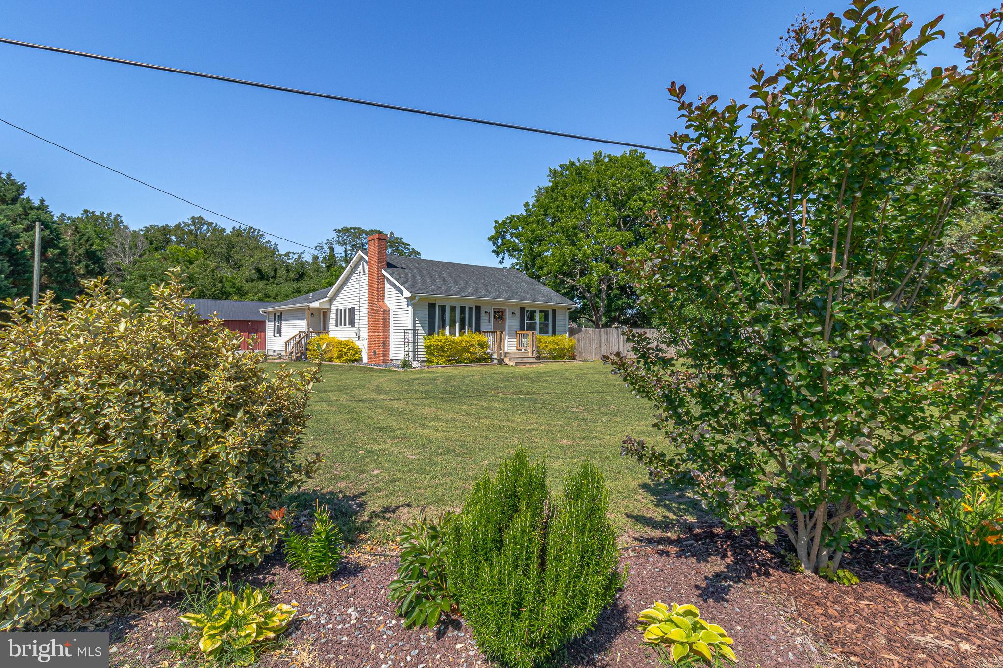 9832 River Road Lancaster, VA 22503 - Photo 64 of 68 Charming home with lush greenery.