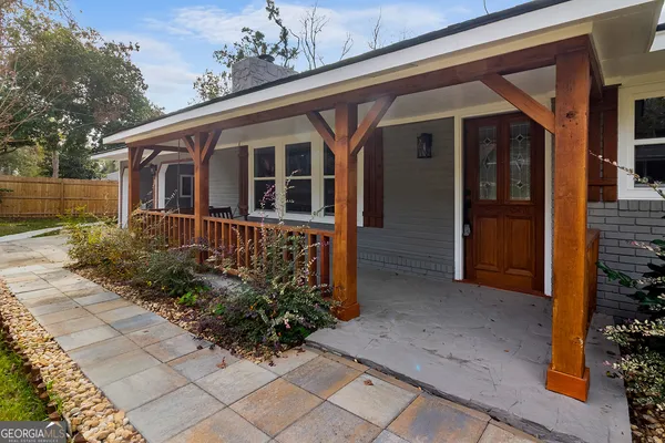 a front view of a house with garden