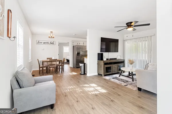 a living room with furniture and a flat screen tv