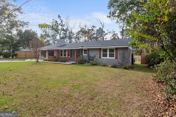 front view of a house with a yard