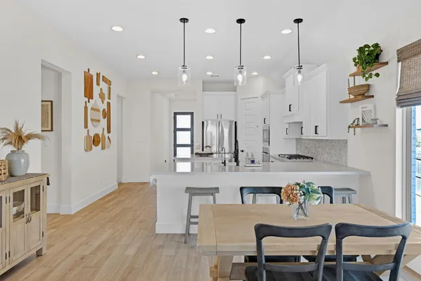 a view of a kitchen and dining room