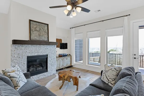 a living room with furniture and a fireplace