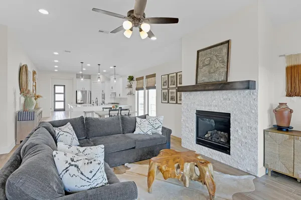 a living room with furniture and a fireplace