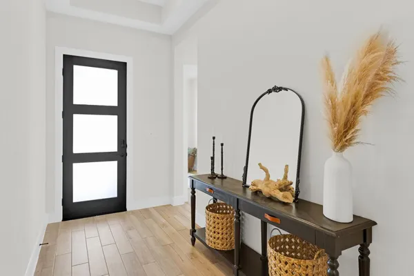 a view of an entryway with wooden floor