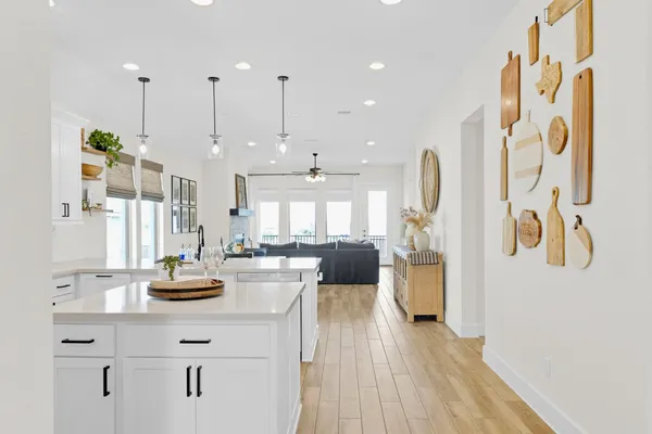 a view of a kitchen with dining room and wooden floor
