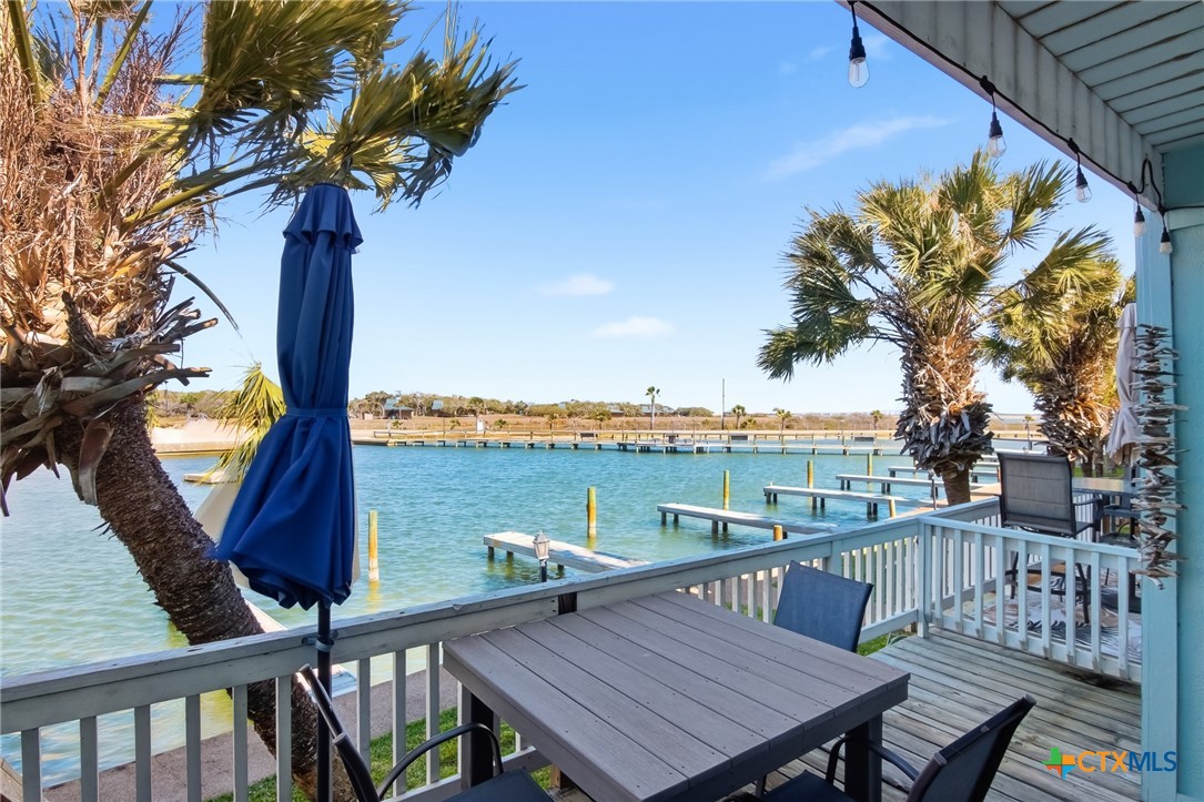 2292 North Fulton Beach Road, Unit 505 Rockport, TX 78382 - Photo 33 of 46 a view of a balcony with furniture and a garden
