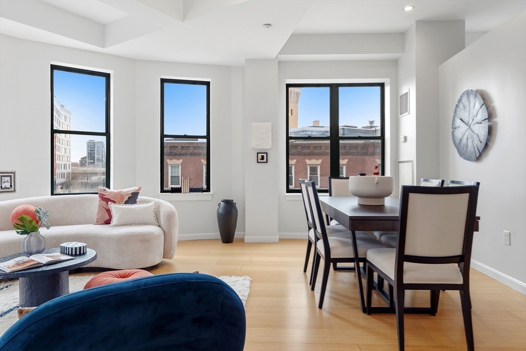 40 Fay Street, Unit 406 Boston, MA 02118 - Photo 2 of 19 a living room with furniture and a large window