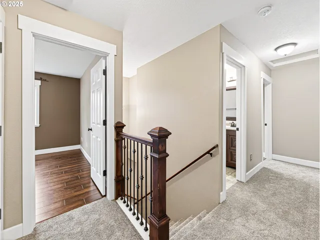 a view of a hallway with entryway door