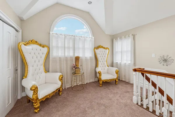 a bedroom with furniture and a window