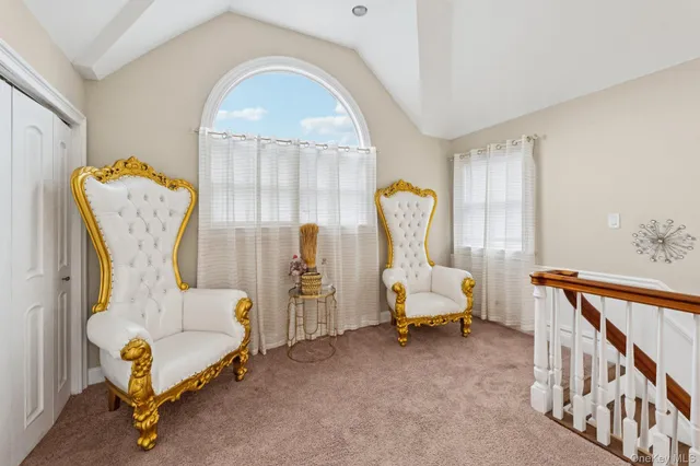 a bedroom with furniture and a window