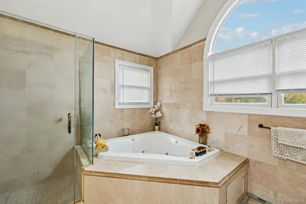 a bath tub sitting in a bathroom next to a sink