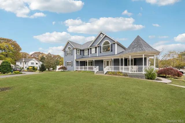 a front view of a house with a garden and porch