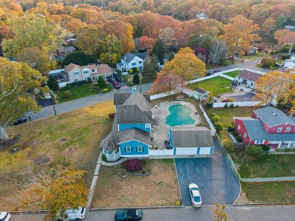 an aerial view of residential house with outdoor space and parking