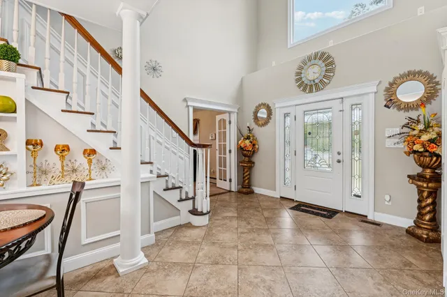 a view of entryway with furniture and livingroom