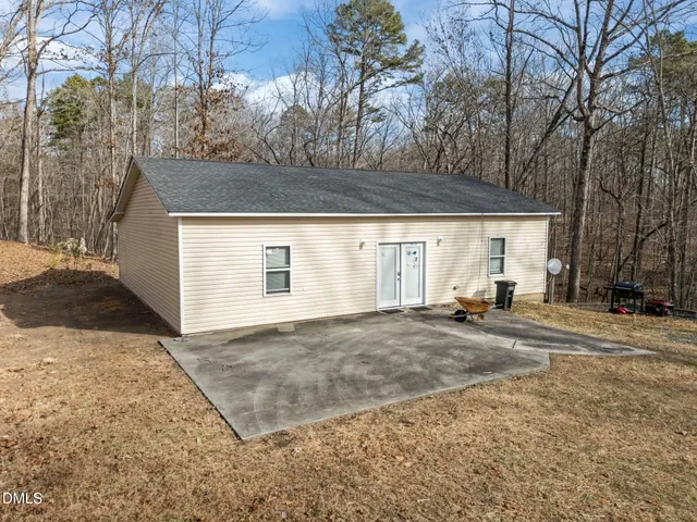 a view of a house with a yard and garage