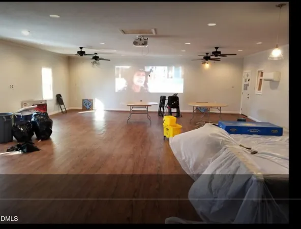 a view of a living room and kitchen