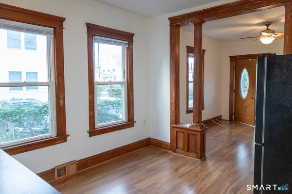 a view of front door with wooden floor