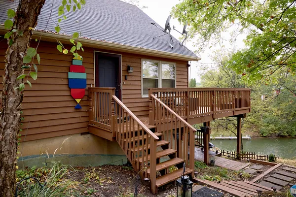 a dining table with chairs and window