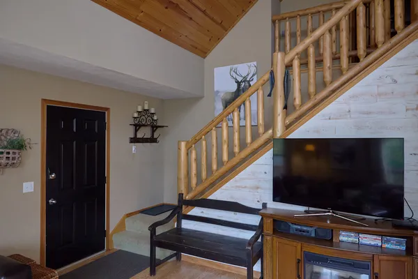 a bedroom with a bed and a chandelier