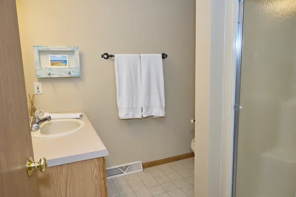 a living room with couches and a flat screen tv