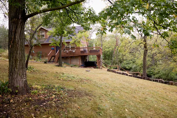 a view of balcony with wooden floor and outdoor seating