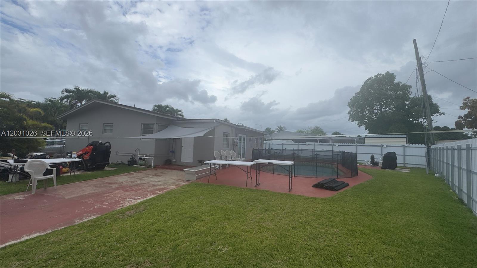 12480 Southwest 189th Street Miami, FL 33177 - Photo 21 of 25 a view of a backyard with sitting area