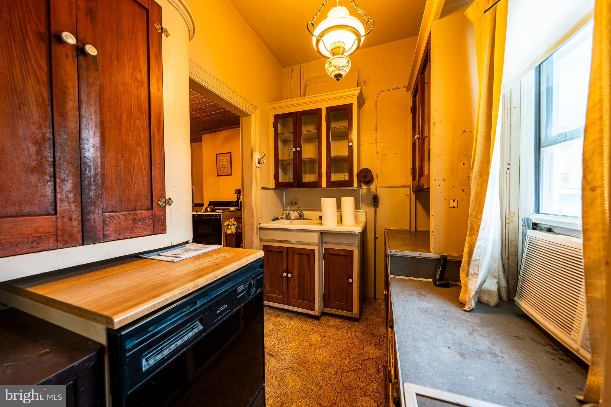 9 Church Lane Baltimore, MD 21208 - Photo 11 of 31 a room with sink stove and large window