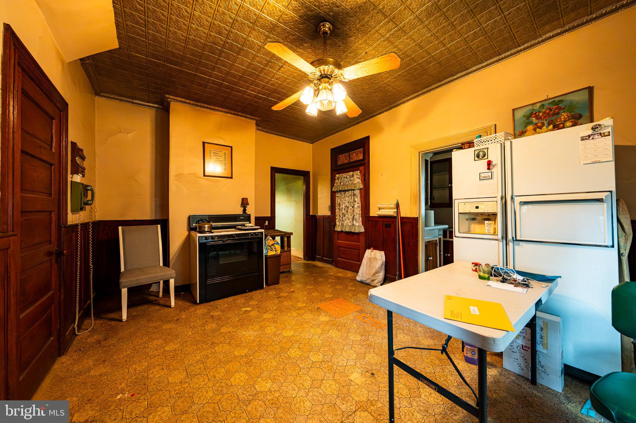 9 Church Lane Baltimore, MD 21208 - Photo 13 of 31 a living room with couches a dining table and chairs with outer view