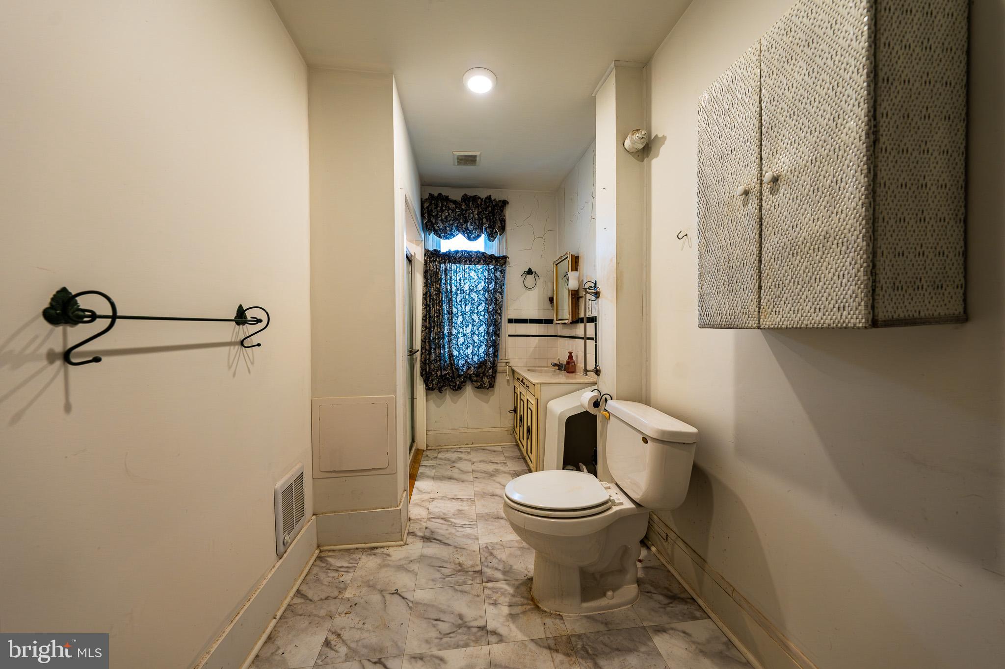 9 Church Lane Baltimore, MD 21208 - Photo 16 of 31 a bathroom with a toilet and a shower