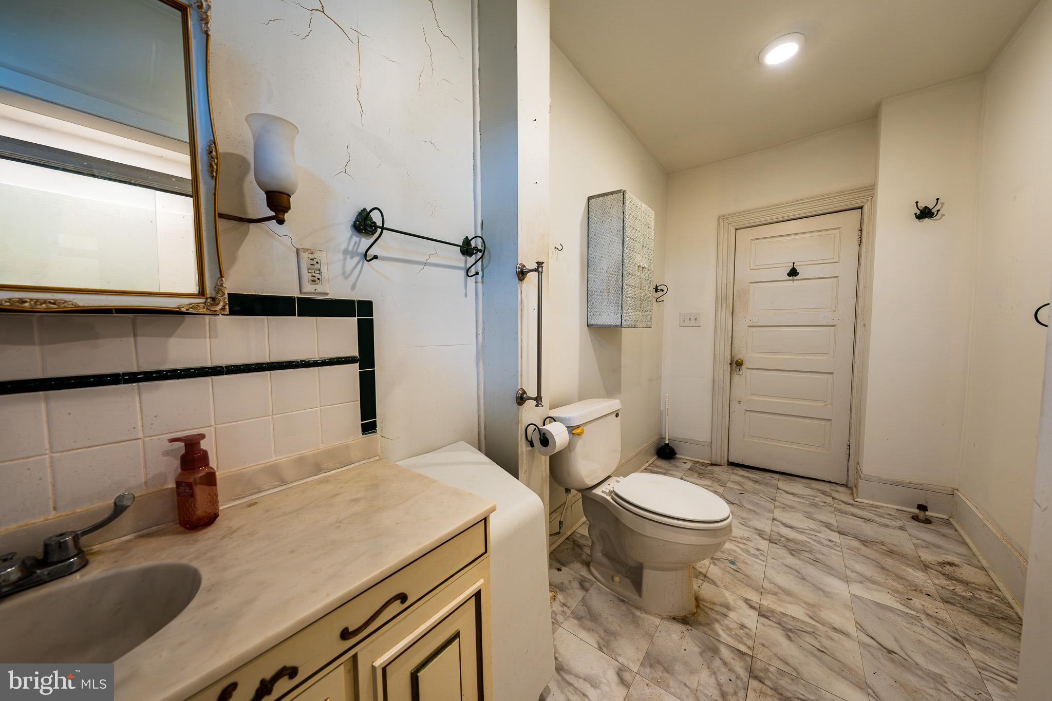 9 Church Lane Baltimore, MD 21208 - Photo 17 of 31 a bathroom with a sink toilet and shower