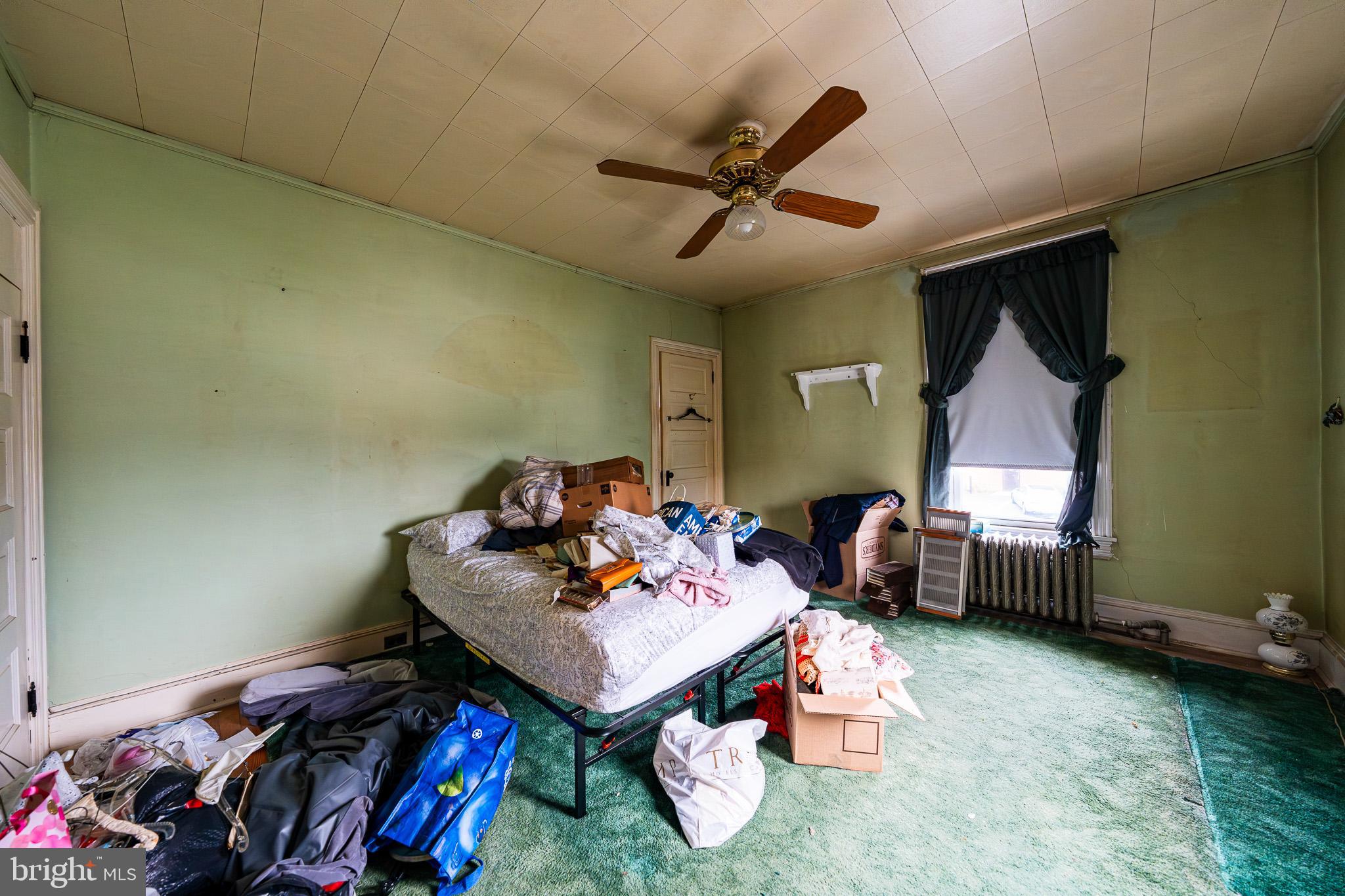 9 Church Lane Baltimore, MD 21208 - Photo 20 of 31 a living room with furniture and a window