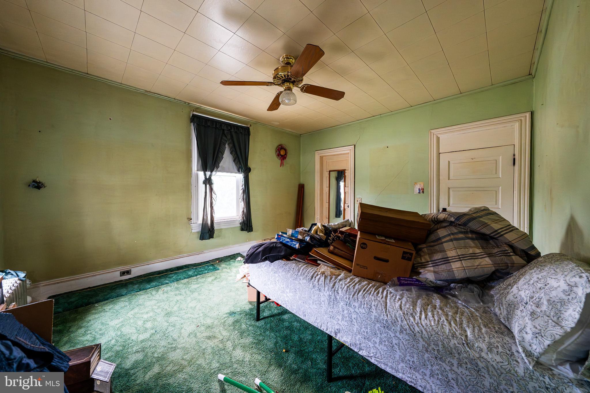9 Church Lane Baltimore, MD 21208 - Photo 21 of 31 a living room with furniture and a window