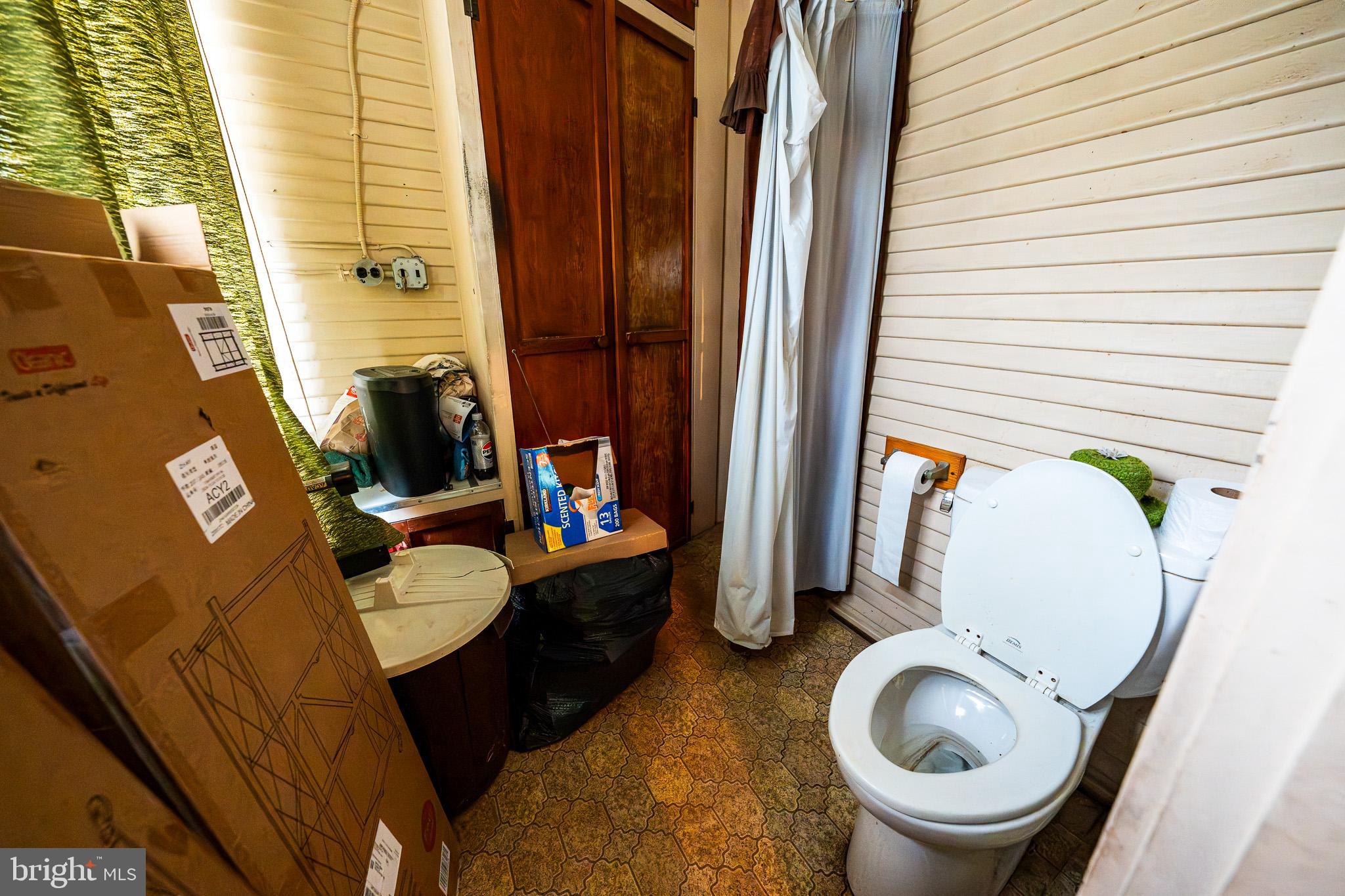 9 Church Lane Baltimore, MD 21208 - Photo 28 of 31 a bathroom with a sink mirror and toilet