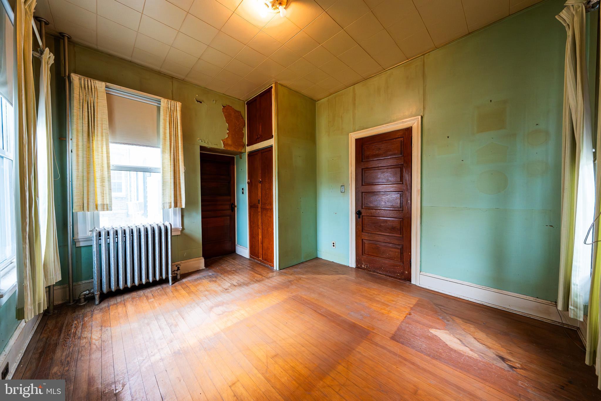 9 Church Lane Baltimore, MD 21208 - Photo 29 of 31 a view of a room with stairs and a wooden floor