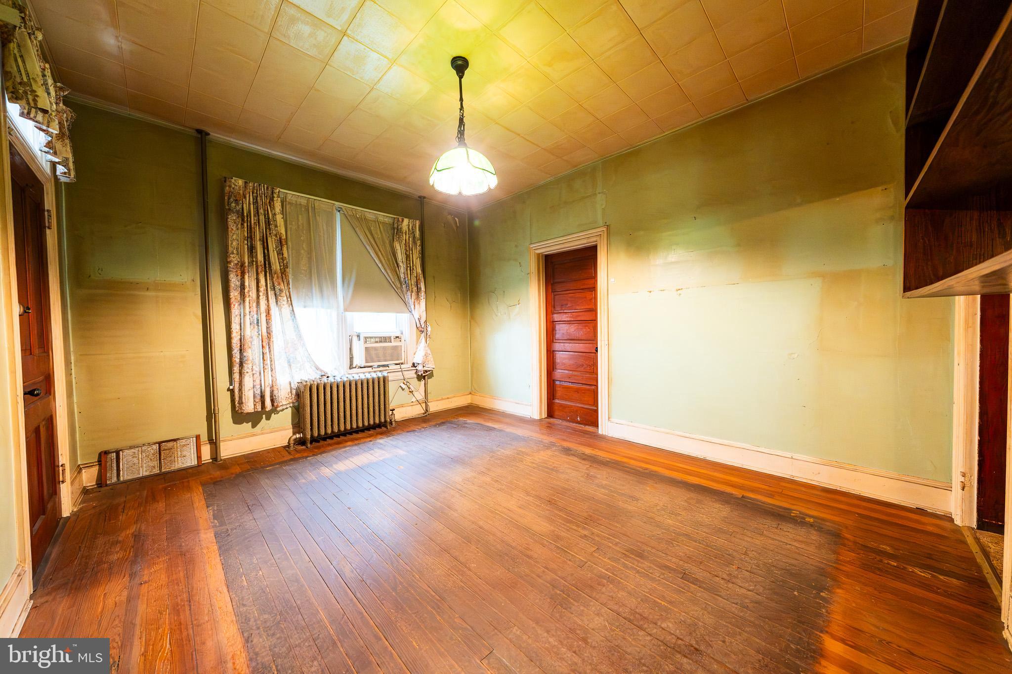 9 Church Lane Baltimore, MD 21208 - Photo 6 of 31 a view of a livingroom with wooden floor and a window
