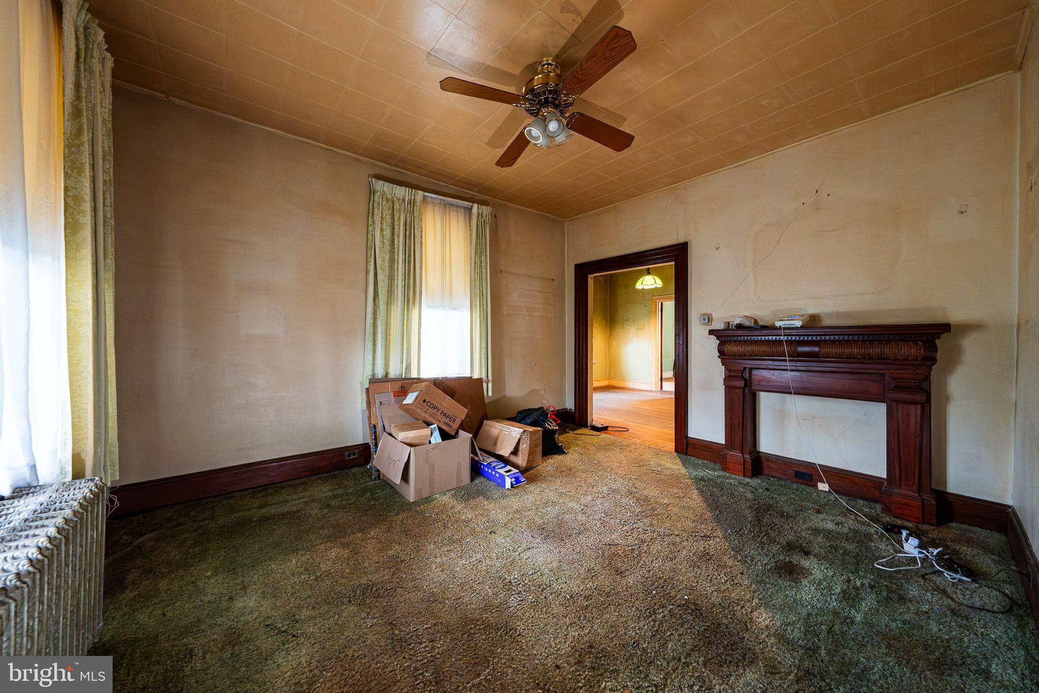 9 Church Lane Baltimore, MD 21208 - Photo 9 of 31 a living room with furniture and a fireplace