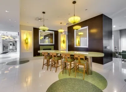 a large kitchen with a table and chairs