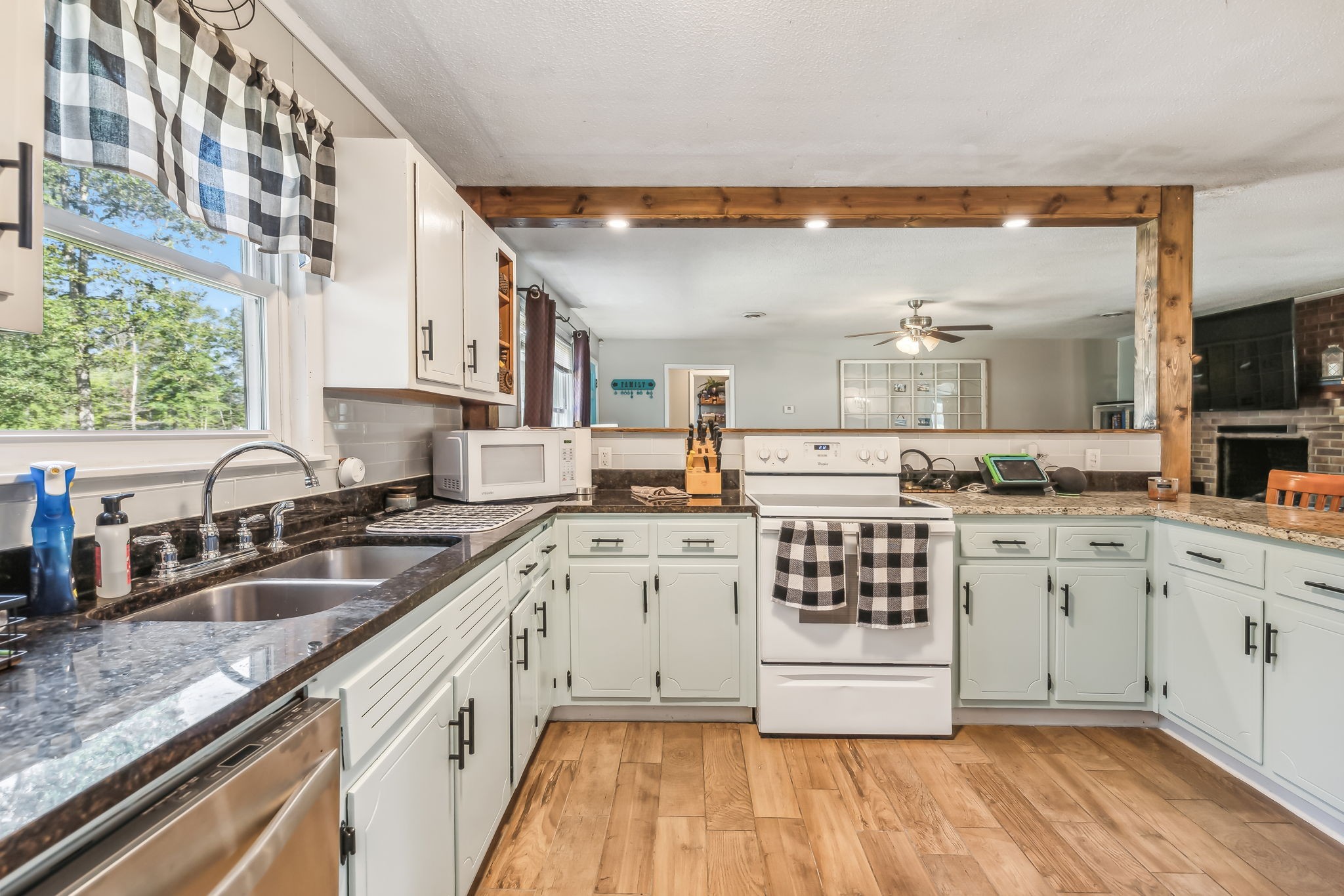 3016 Pocahontas Road Morrison, TN 37357 - Photo 5 of 47 a kitchen with granite countertop a sink and cabinets