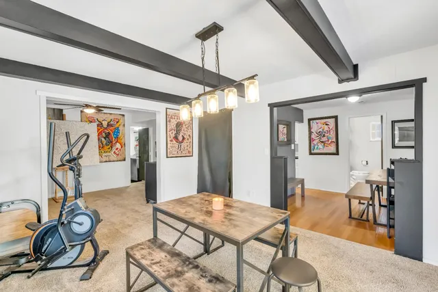 a dining room with furniture and window
