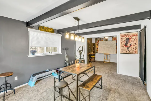 a living room with fireplace furniture and a flat screen tv